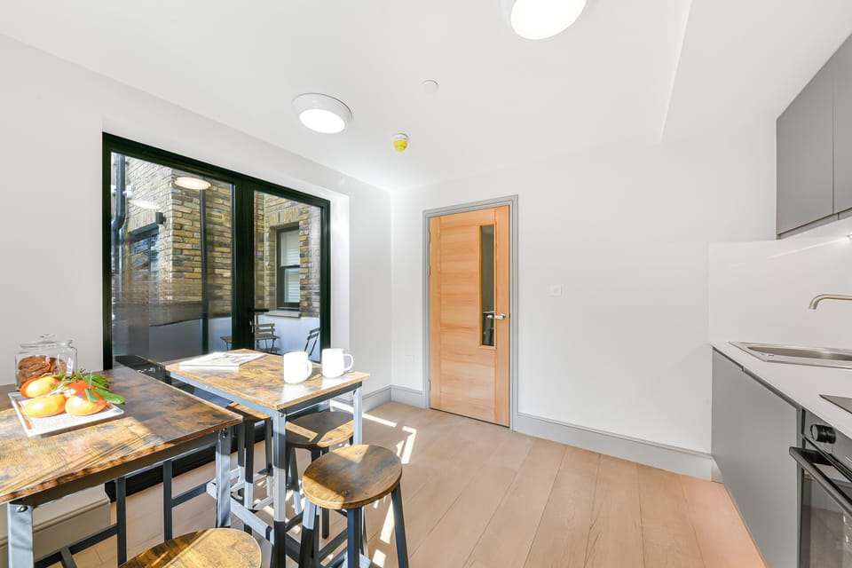 Communal kitchen leading to communal patio