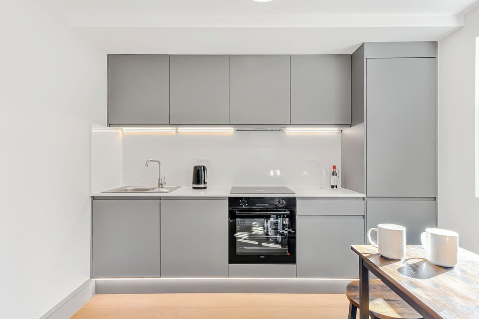 Communal kitchen equipped with oven, microwave, electric hob, kettle, fridge