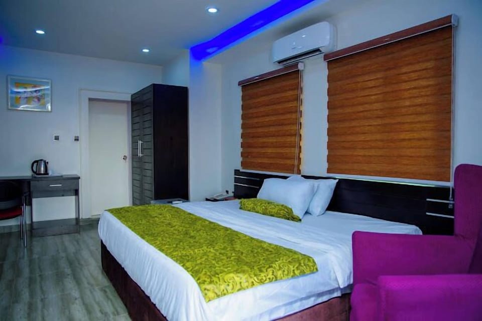 Deluxe Room, Balcony, City View | Desk, laptop workspace, blackout drapes, soundproofing