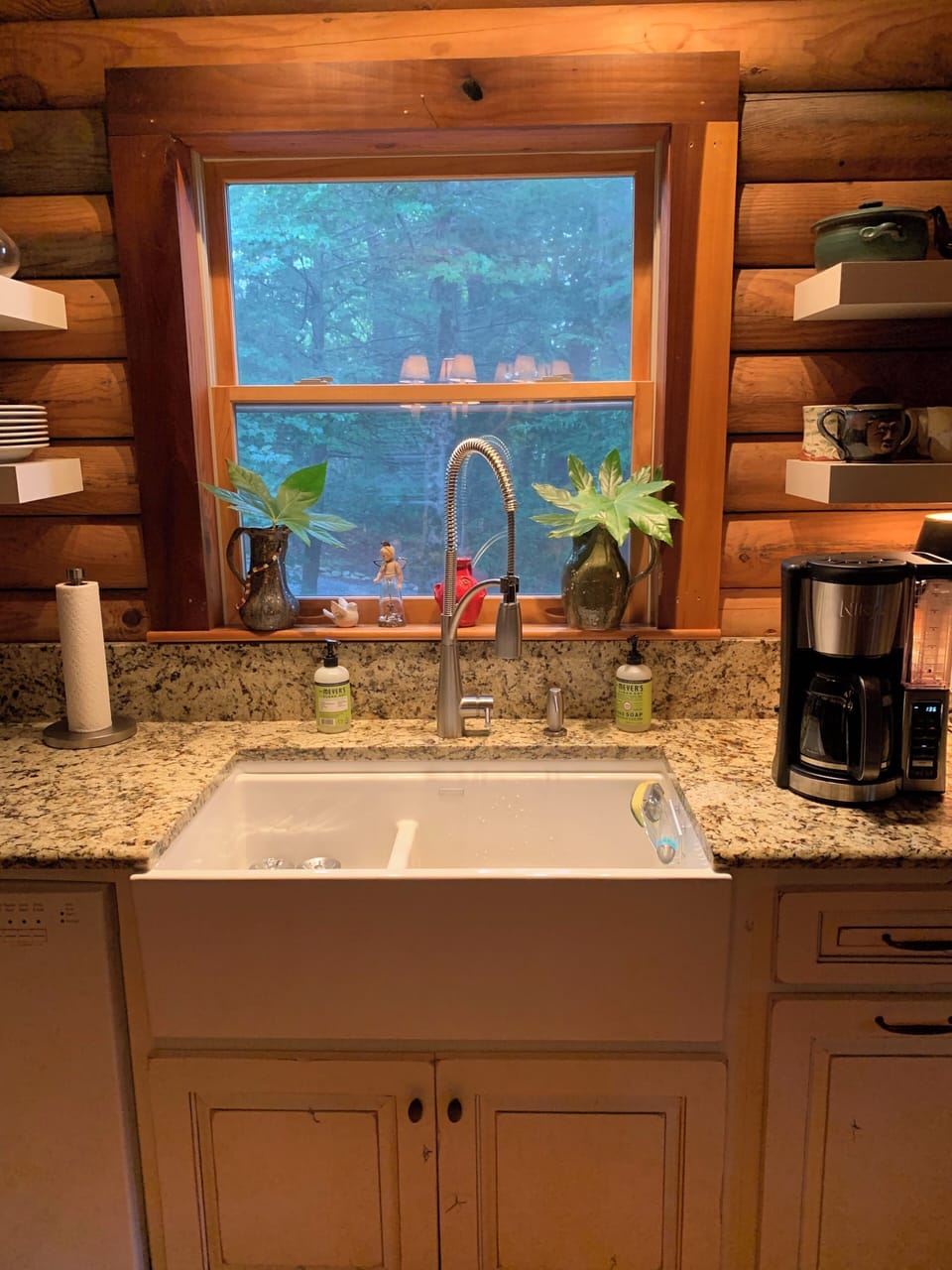 Kitchen sink with floating shelves on each side