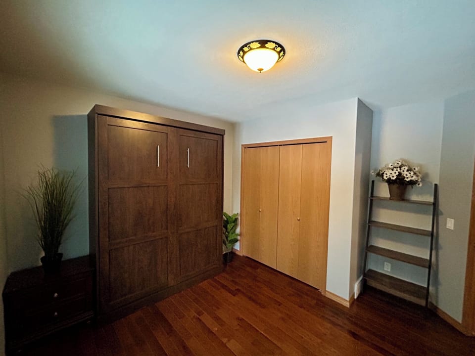 Second Bedroom - queen bed, closet, and peloton 