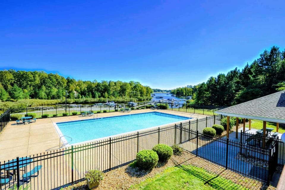 Community Pool - The Waters' lakeside pool sits just steps from the marina, an easy walk for afternoon laps and sunny lounging by the water.