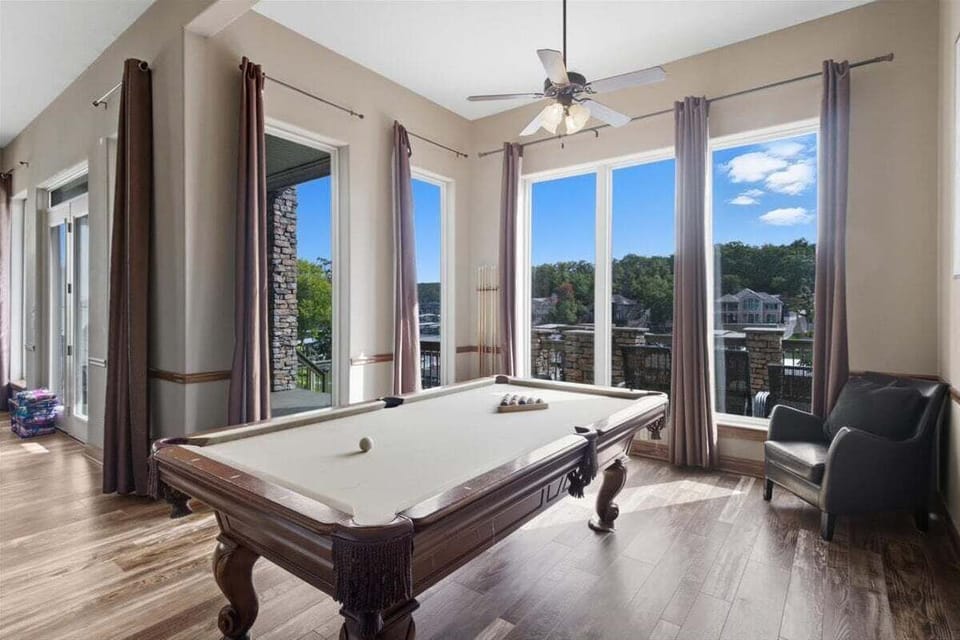 Play a lively game of pool, foosball, Golden Tee, Pac Man or Ms. Pac Man in the lower level game room/living area with high ceilings and a full eat in kitchen.