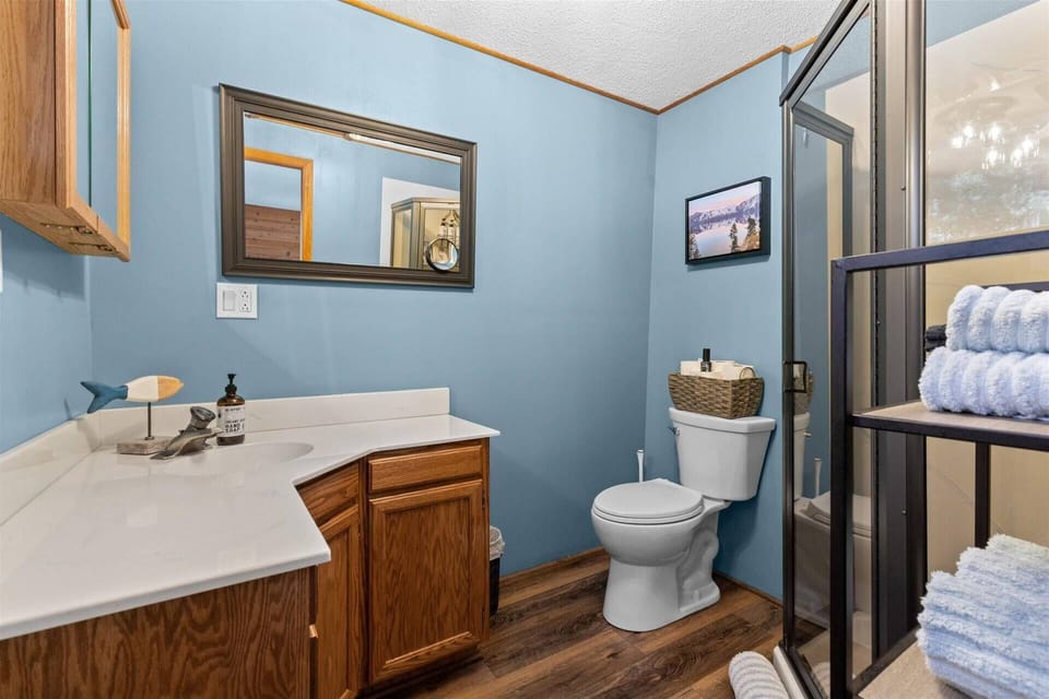 Upstairs bathroom with shower, toilet, and sink!
