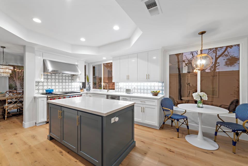 Fully equipped with high-end appliances and a spacious island for cooking and gathering.