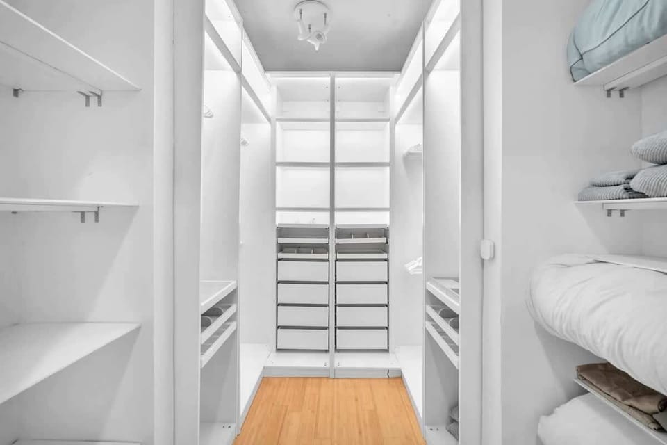 Spacious walk-in closet with ample shelving and storage. Perfect for organizing your belongings and keeping your stay clutter-free.