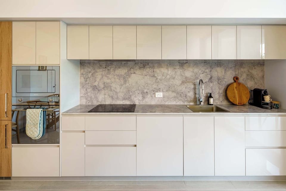 Fully equipped kitchen with sleek cabinetry and modern appliances