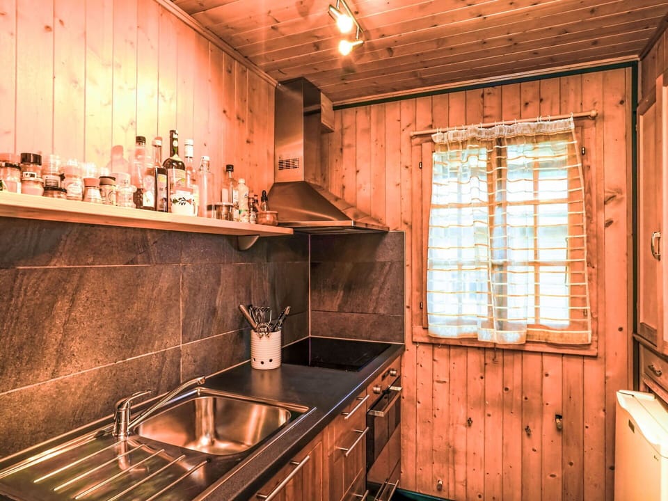 Wood, Ceiling, Floor, Flooring, Wood Stain, Hardwood, Room, Light Fixture, Log Cabin, Kitchen