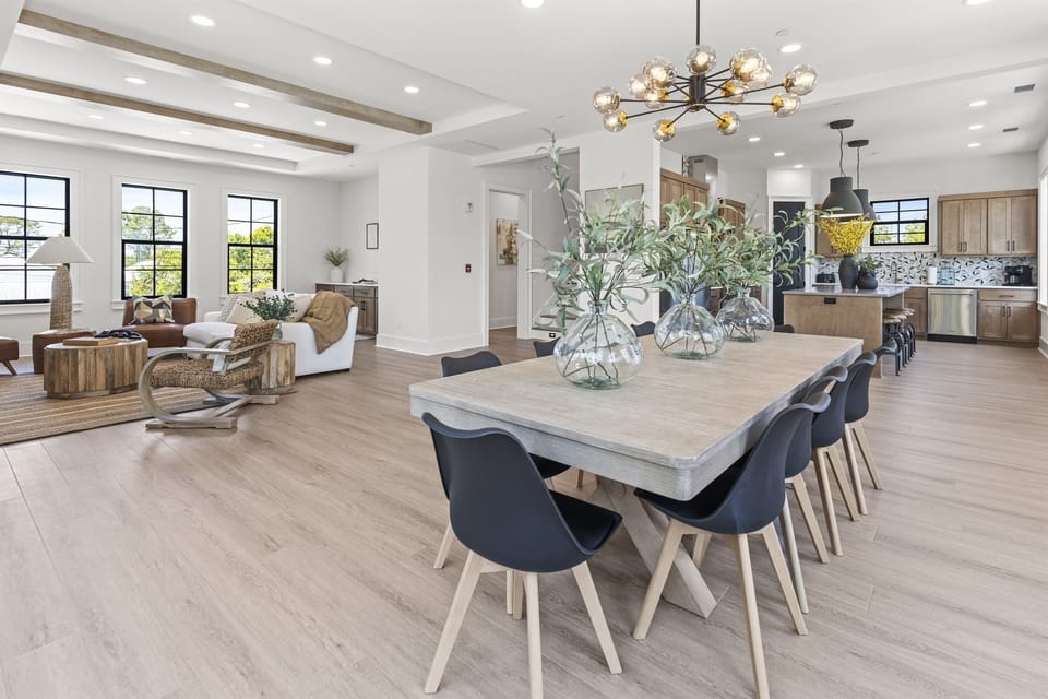 You'll love gathering around this stunning dining table, with your open-plan living space flowing seamlessly to the modern kitchen.