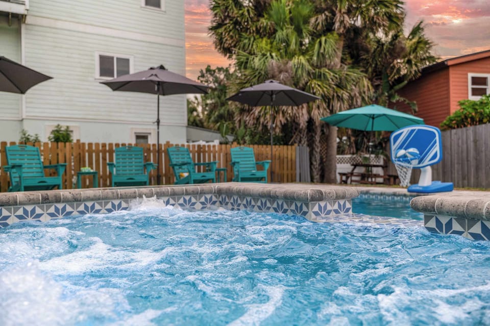 Our back yard has an in ground pool (non heated), built in hot tub, shade, lounge furniture, pool toys, and a picnic table.