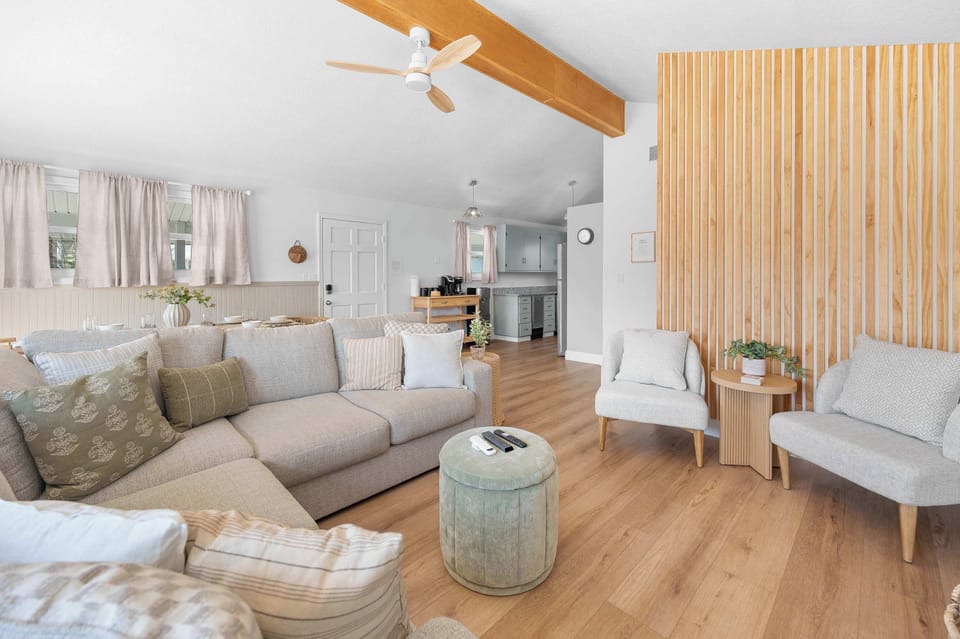 Open concept living in the upper unit. Dining, living and kitchen are in one large space. Two sliding glass door options take you to the 2nd level deck where you can relax, socialize, and dine.