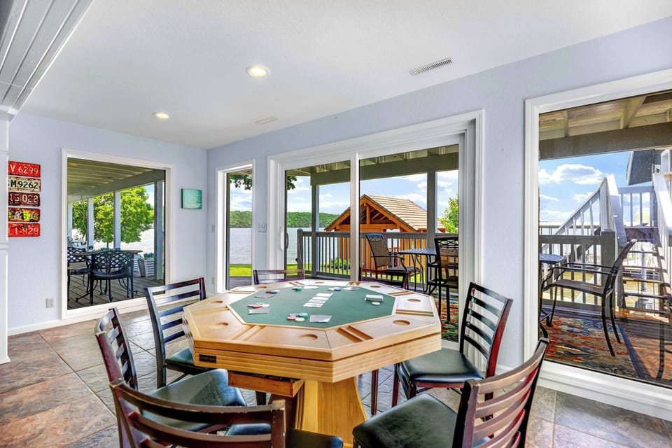 Basement living area with wet bar, sitting area, Smart TV and game table
