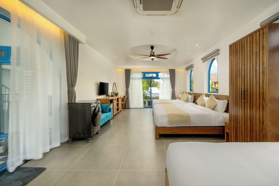 Family Studio Suite, Multiple Beds, Balcony, City View | Minibar, in-room safe, desk, laptop workspace