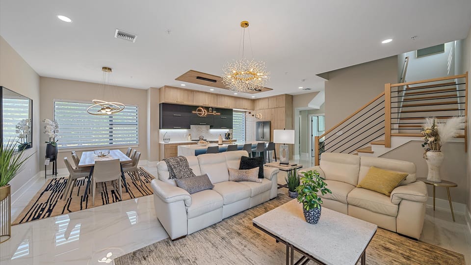 An alternate view of the spacious open-concept floor plan, showcasing the seamless flow between the living room, dining area, and gourmet kitchen.