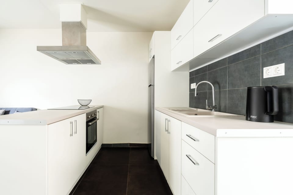 Junior Duplex, Balcony | Private kitchen | Electric kettle