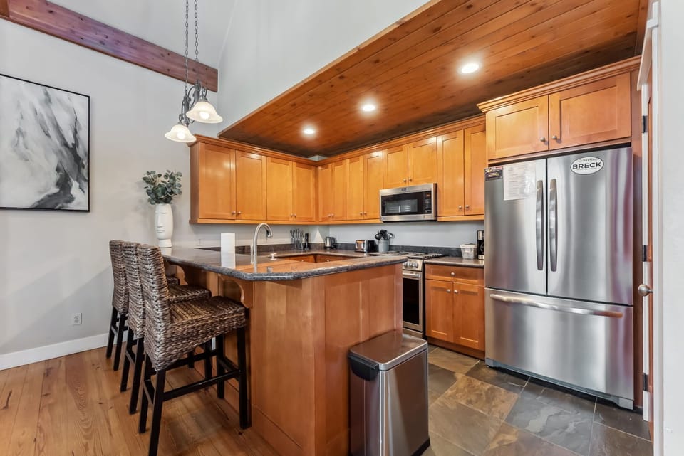 Kitchen: Main floor, drip coffee maker, Keurig, toaster, cooking utensils, tableware