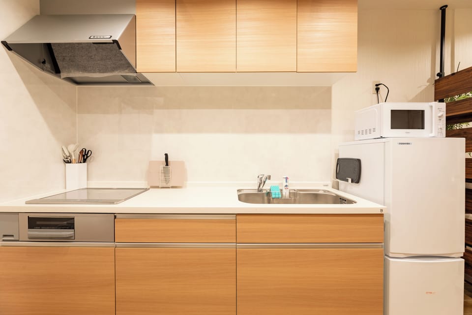 Apartment | Private kitchen | Fridge, microwave, stovetop, cookware/dishes/utensils