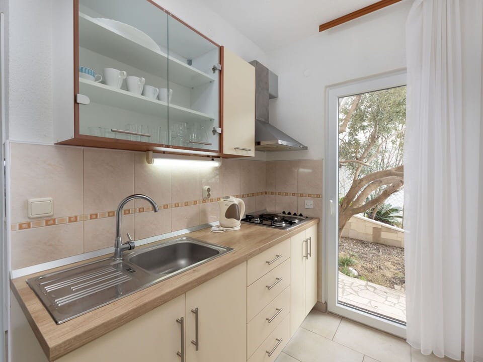 Kitchen, Countertop, Kitchen Appliance, Major Appliance, Kitchen Sink, Cabinetry, Wood, Sink, Flooring, Interior Design