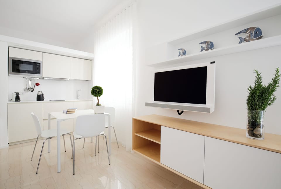 Superior Apartment | Living area | 42-inch Smart TV with satellite channels