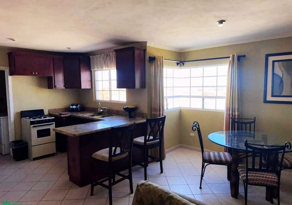 Save money and eat on your schedule. This full kitchen at Casa Bugambilia vacation rental in San Felipe BC Mexico comes with stove, fridge, and counter space — cook just like at home.