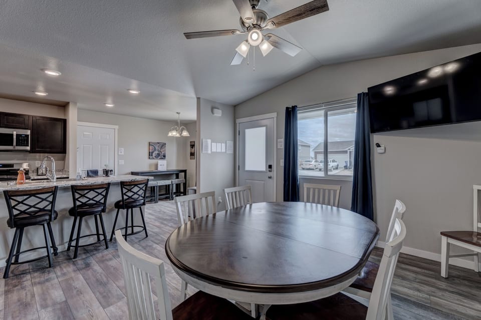 Main floor dining area with 50" Smart TV