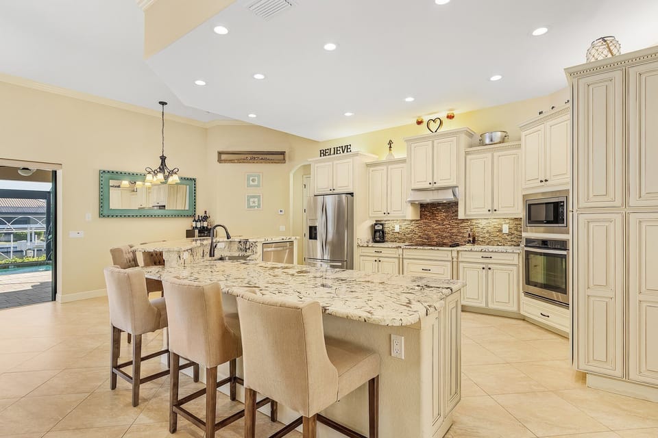 Paneled cabinets and stainless steel appliances