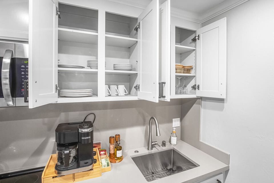 A chef-friendly kitchen with everything you need—modern appliances, cookware, and plenty of counter space to whip up meals or snacks.