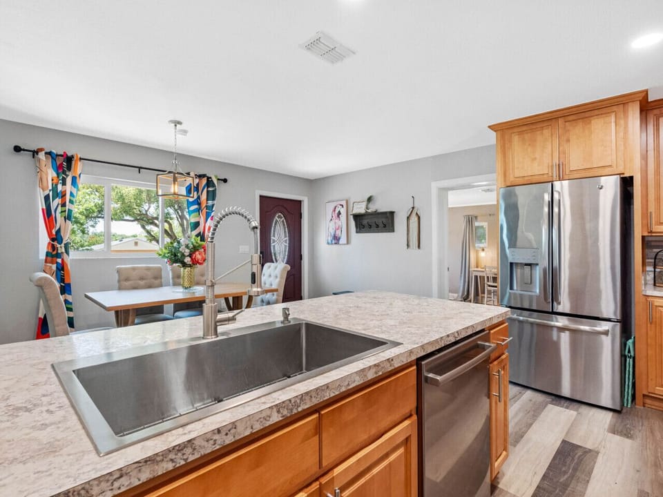 You are greeted by the open kitchen and dining area