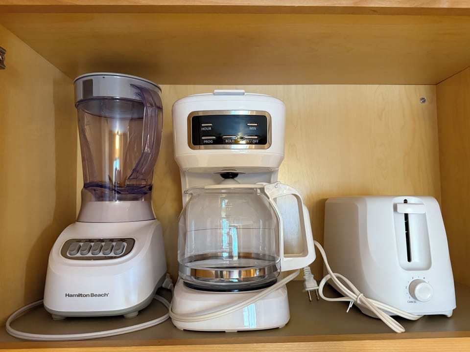 Many small kitchen appliances available for your use. 