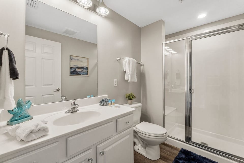 Hallway full bath with shower—convenient for guests and family members alike