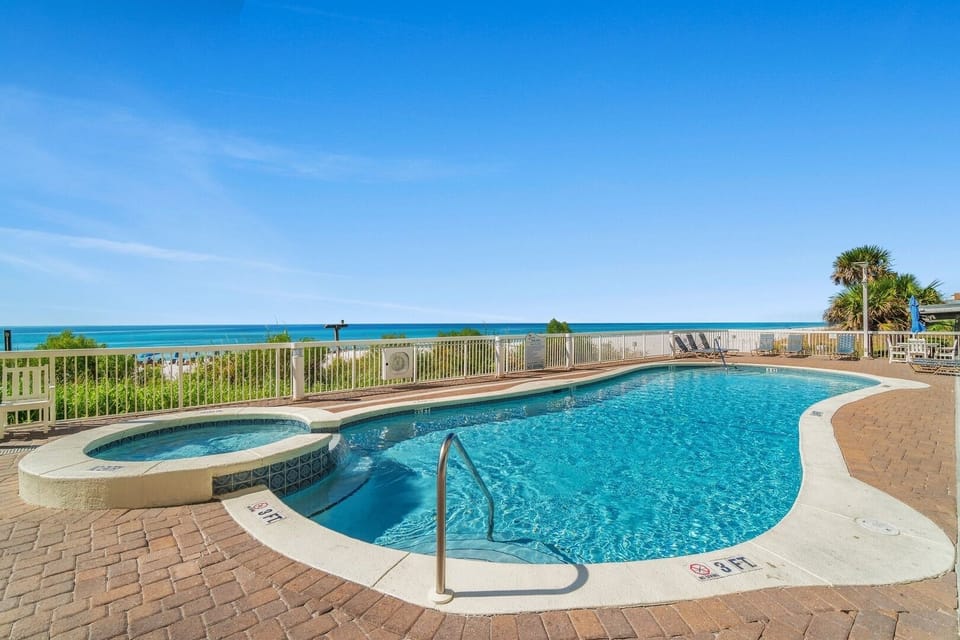 Two sparkling beachfront pools — one seasonally heated — plus a hot tub for cooling off or relaxing after beach days.