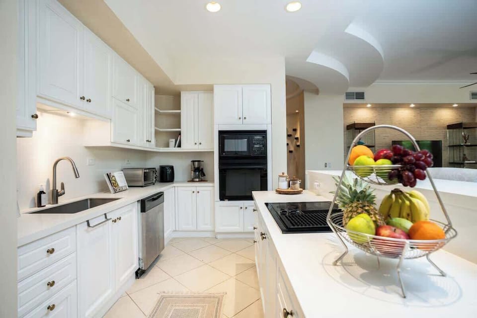 Generous open kitchen fully equipped with breakfast island  