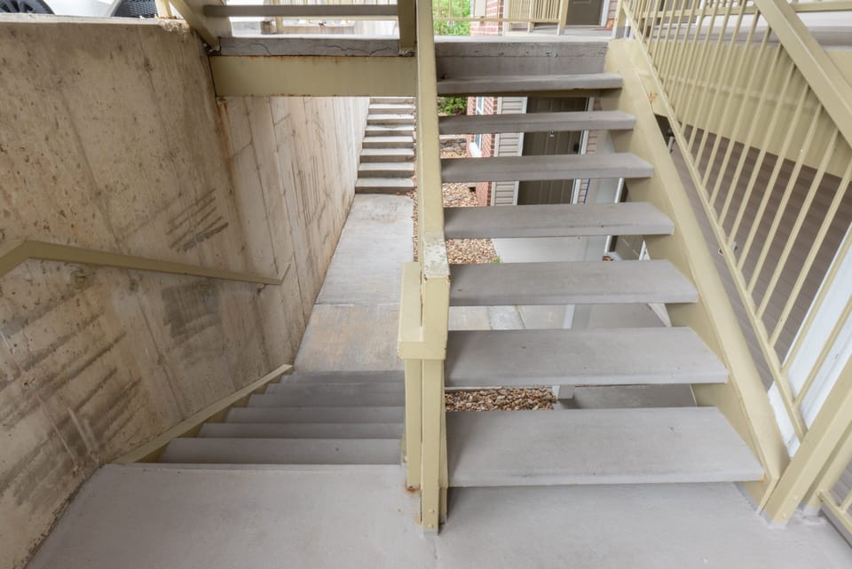 2 Flights of Stairs - About 15 steps from Parking Lot
