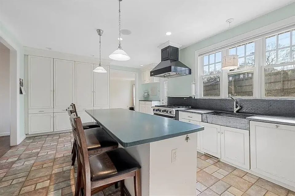 Full Kitchen for cooking and eating meals, with bar stools at the counter 