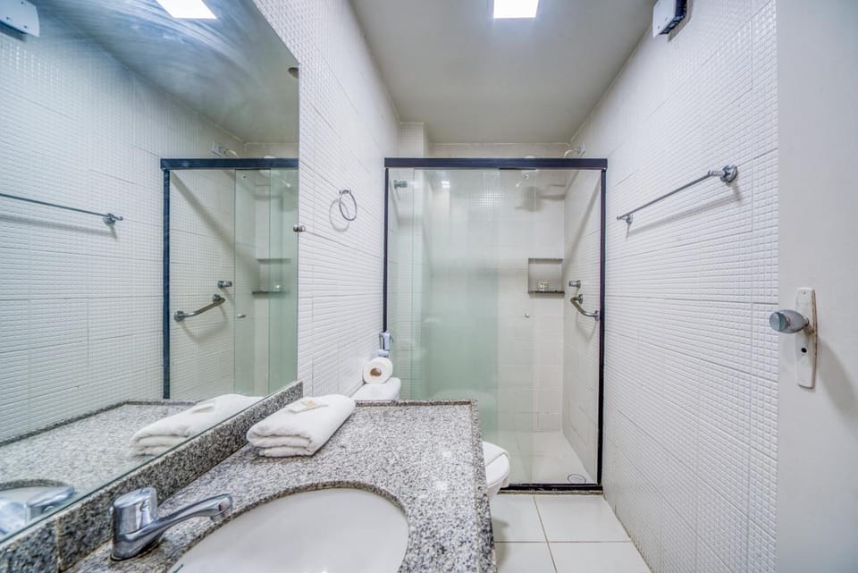 Shower, hair dryer, towels, shampoo