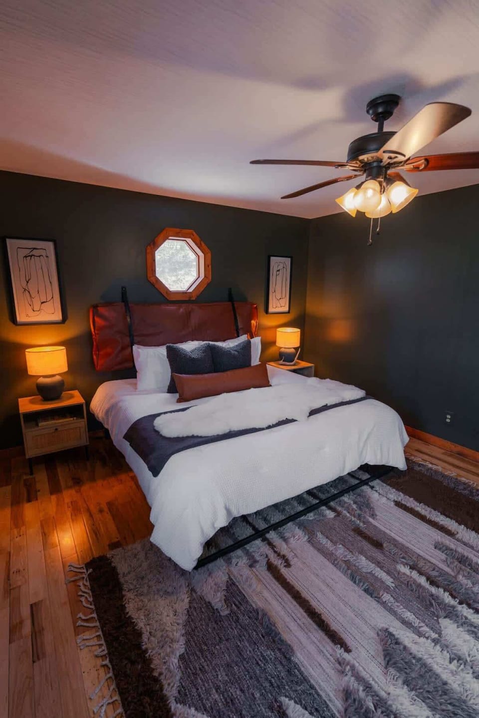 Bedroom Retreat: Stylish decor, warm lighting, and a unique view create your perfect retreat!
