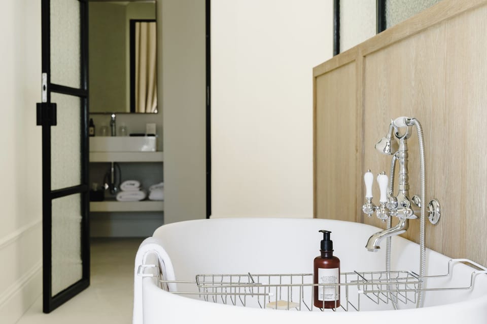 Signature Suite | Bathroom | Hair dryer, towels