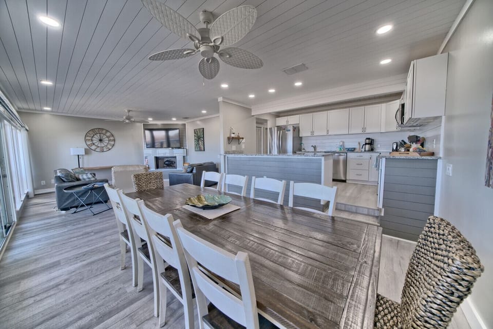 Open layout with cozy seating, a large dining table, and a smart TV-ready for fun