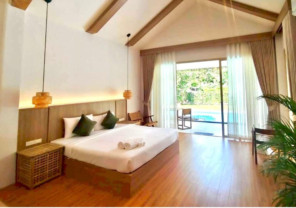 Deluxe Room, 1 Bedroom, Pool View, Ground Floor | Desk, laptop workspace, free WiFi, bed sheets