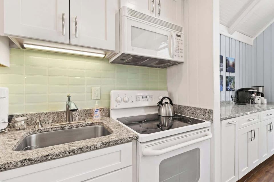 Indulge in culinary elegance within our contemporary white kitchen. This pristine space combines modern aesthetics with functional brilliance, offering a canvas for both culinary creativity and refined style.