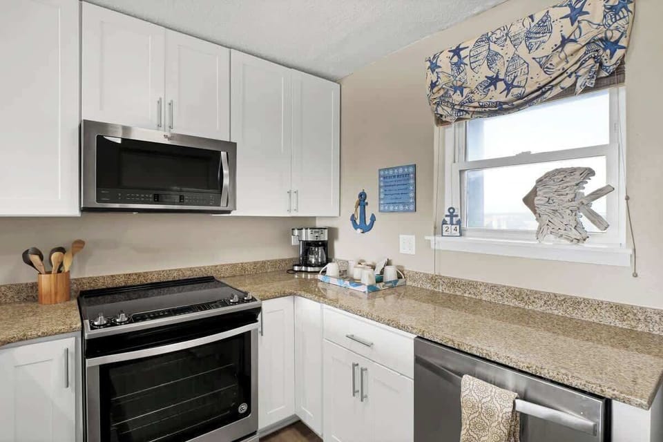An impeccably stocked kitchen awaits, equipped with everything you need for a delightful culinary experience.