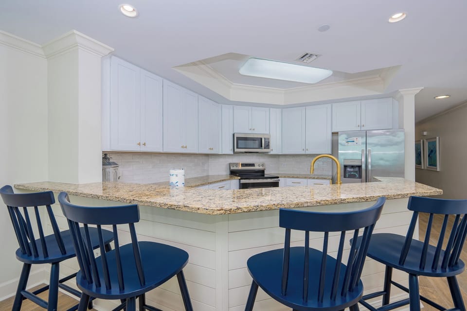 Gather at the stylish breakfast bar, sharing laughter and stories while enjoying moments that feel like home
