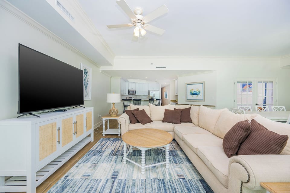 Nestle into the plush sectional, enjoying quality family time while watching your favorite shows in this living space