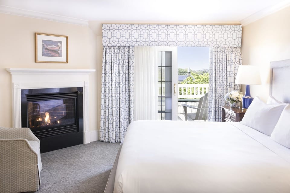 A cozy fireplace and private balcony make this suite the perfect blend of warmth and serenity.