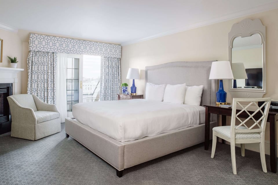 Plush bedding, natural light, and refined decor combine for a restful and luxurious escape.