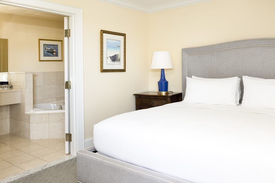 Plush bedding and soft lighting create a peaceful retreat for a restful and rejuvenating stay.