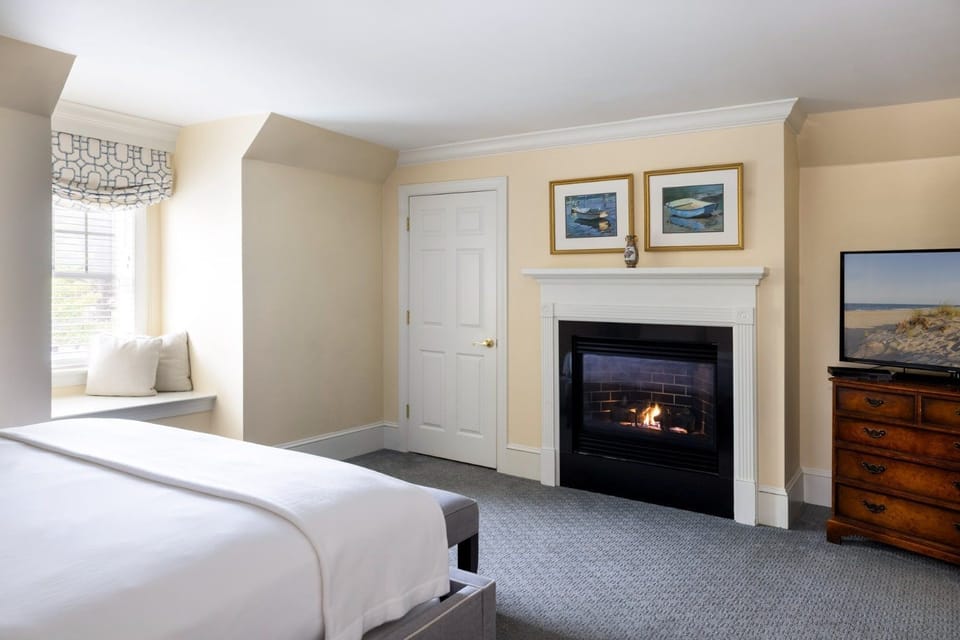 A cozy fireplace adds warmth and charm, creating a serene escape for ultimate relaxation.