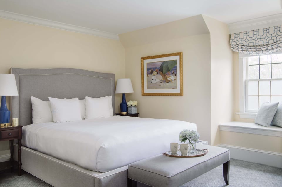 Elegant décor and natural light make this inviting bedroom a true haven of comfort.