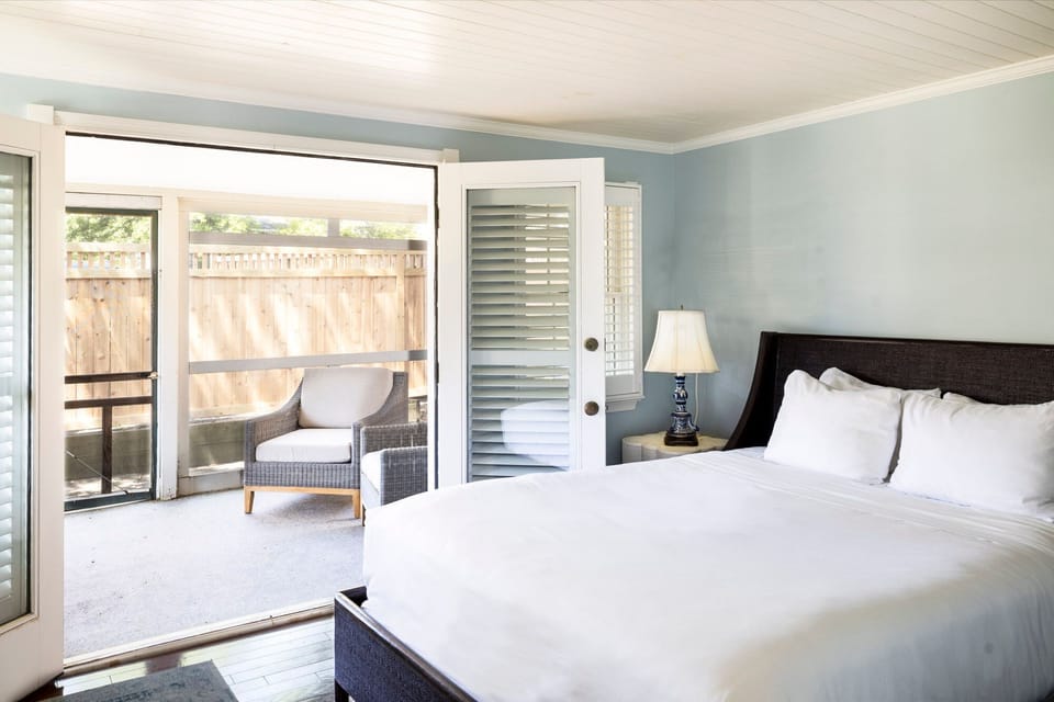 A serene bedroom with seamless indoor-outdoor flow, perfect for enjoying fresh air and natural light.
