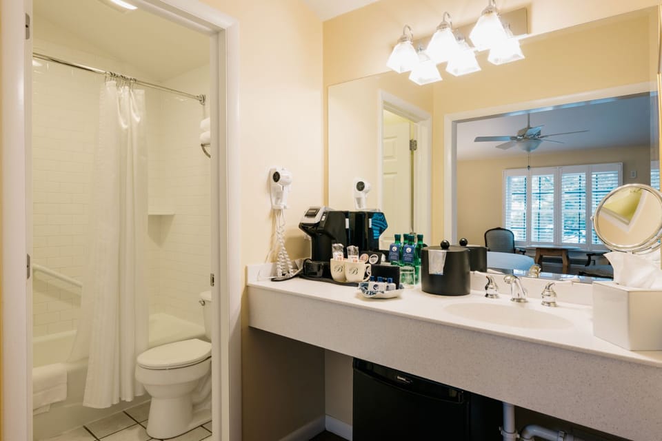 A bright and modern bathroom with sleek finishes and thoughtful amenities.